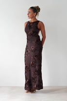 Brown midi dress with ruched bust, tie shoulder straps, and a flowy silhouette in soft fabric, styled for casual chic or transitional outfits.