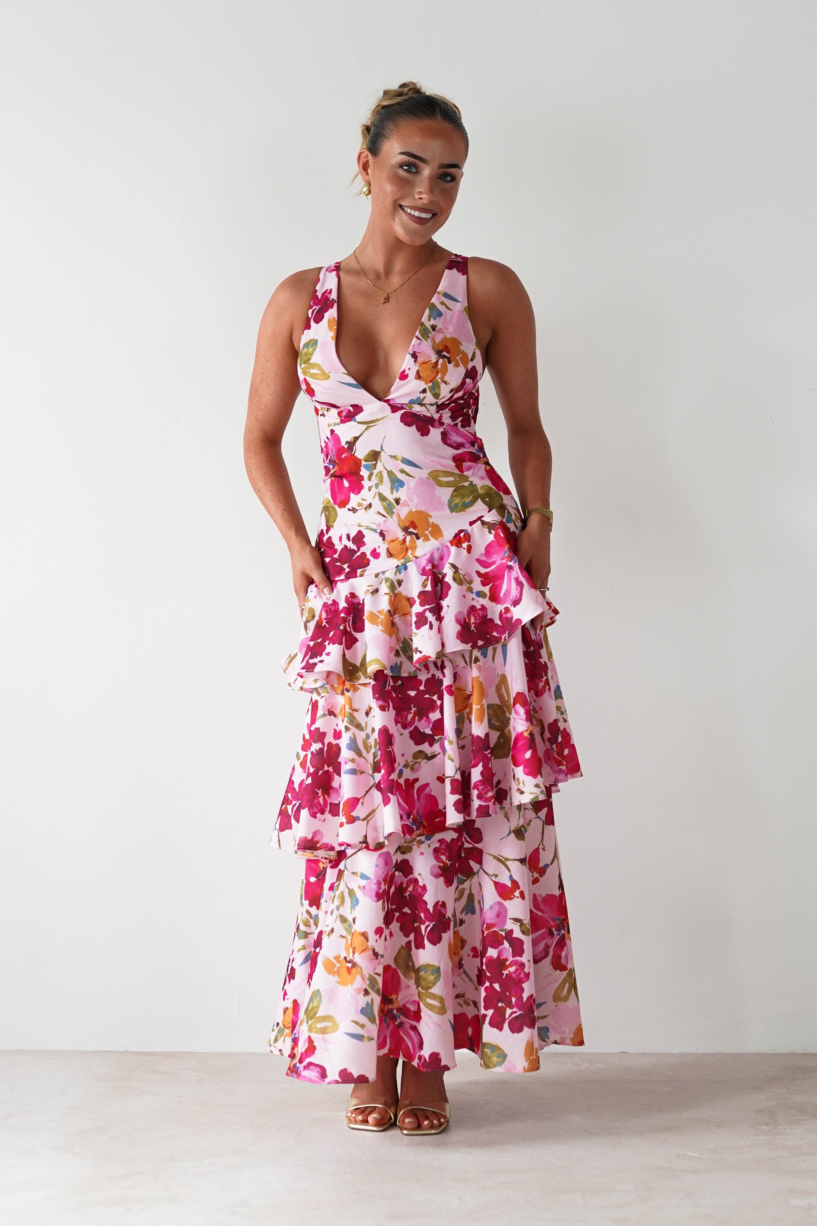 Pink Wedding Guest maxi dress with tiered skirt, bow tie shoulder straps, and smocked back, designed in soft cotton-touch fabric for a breezy and feminine look.