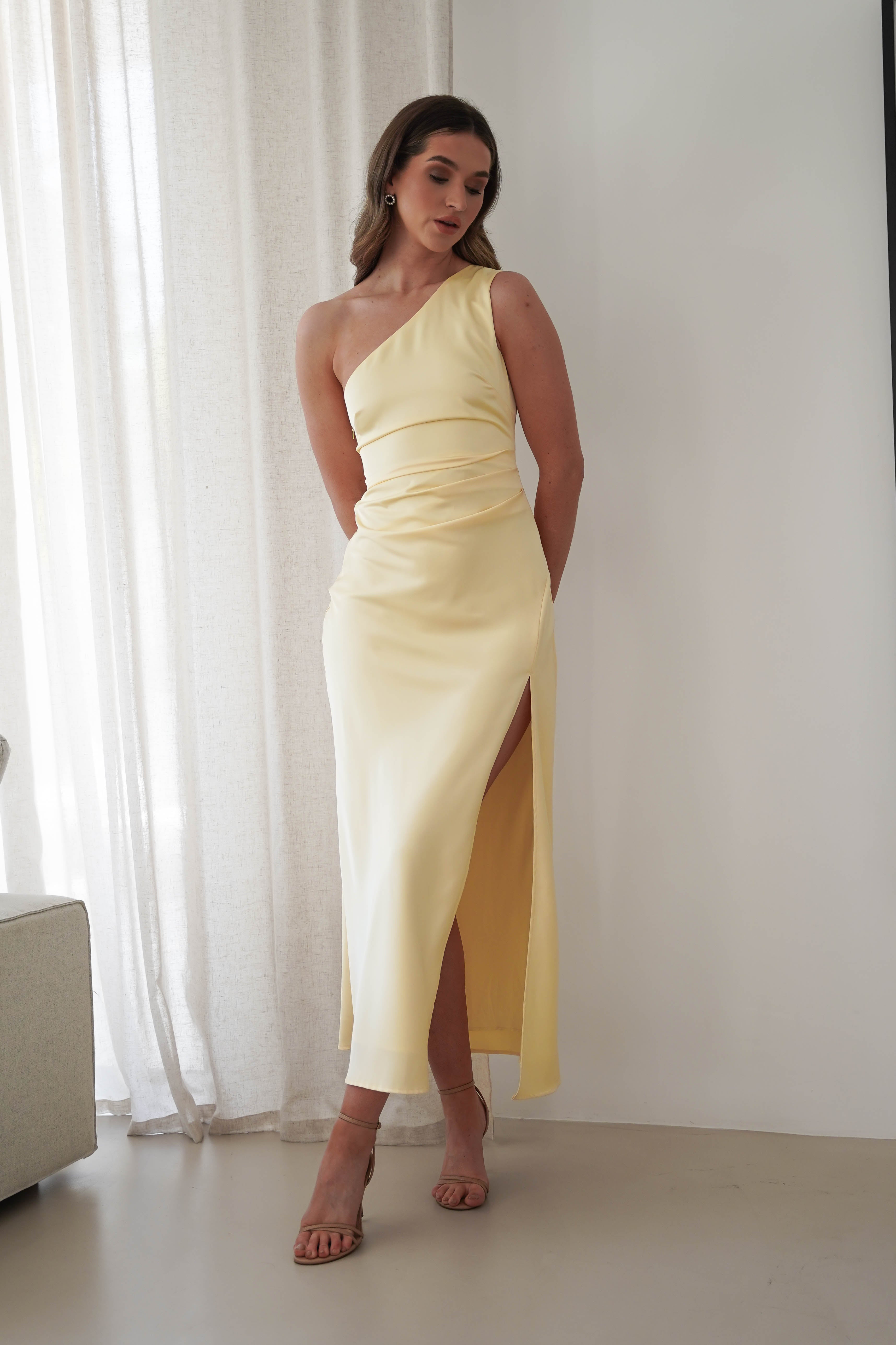 One of our models in a fashionable yellow dress from our women's clothing online
